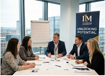 ILM leadership team meeting with Unlocking Potential banner